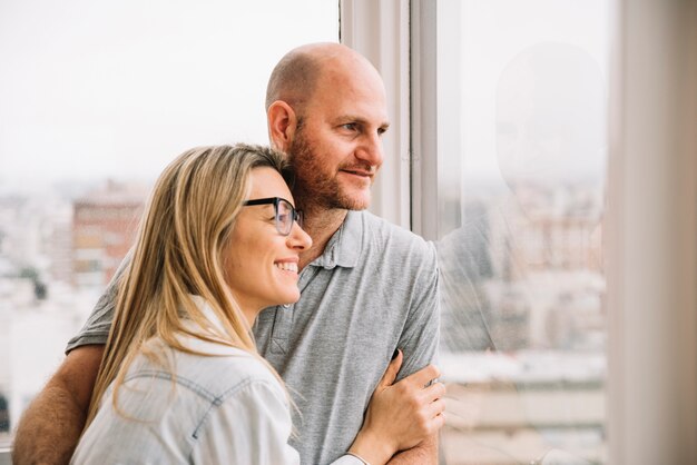 Free Photo couple in love in front of window