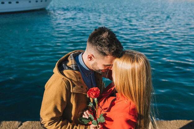 Couple in love posing on city seafront