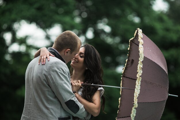 Couple in love with an umbrella