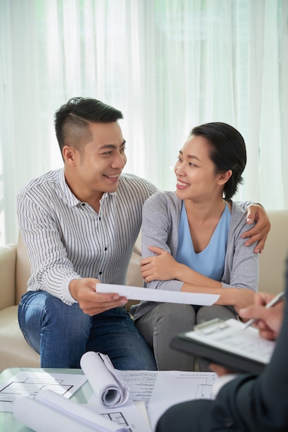 Couple meeting estate broker