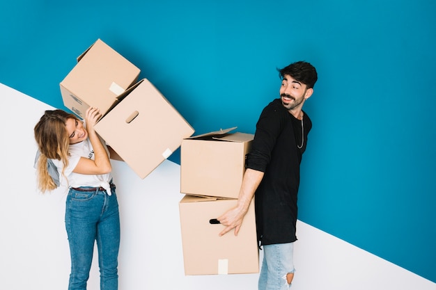 Couple moving to new flat with boxes