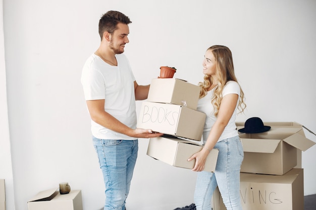 Couple moving and using boxes