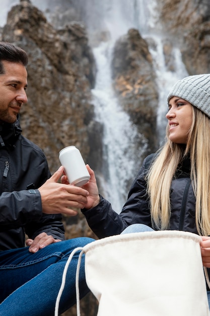 Free Photo couple in nature on break from hiking