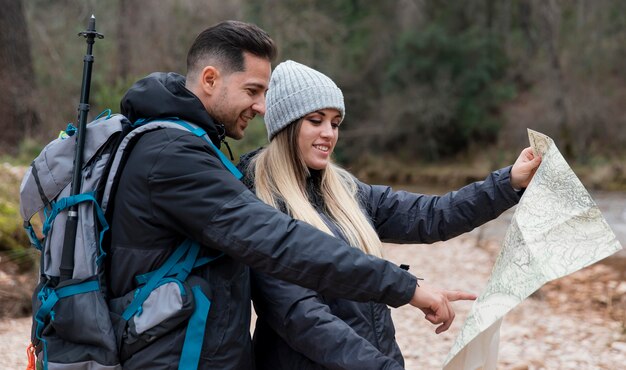 Couple in nature consulting map