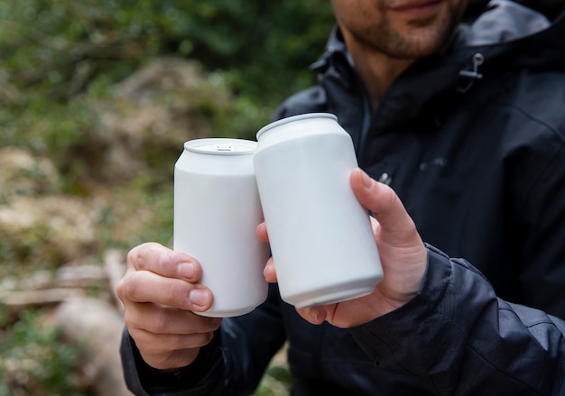 Free photo couple in nature drinking beverage close up