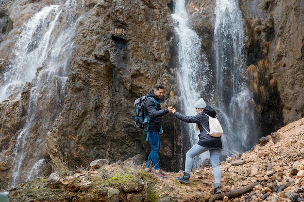 Free Photo couple in nature hiking