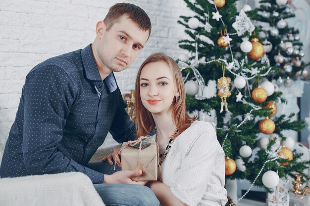 couple near christmas tree