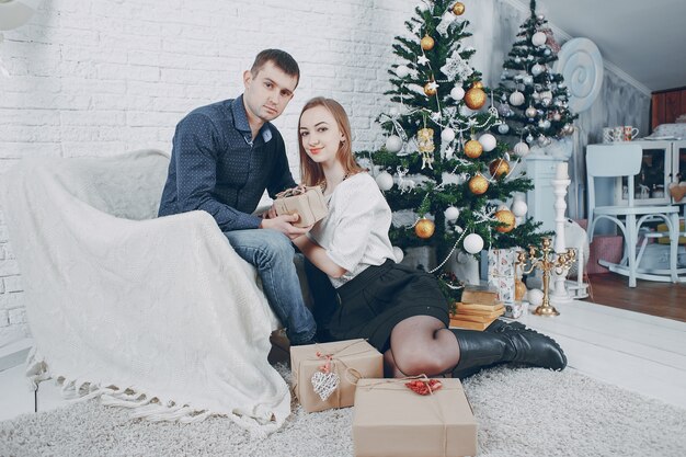 couple near christmas tree