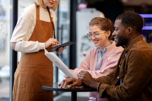 Couple ordering food at restaurant