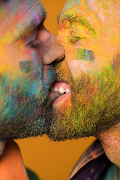 Free photo couple of painted homosexual men kissing passionately