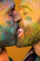 Free photo couple of painted homosexual men kissing passionately