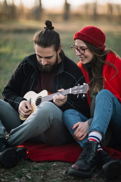 Couple playing the guitar