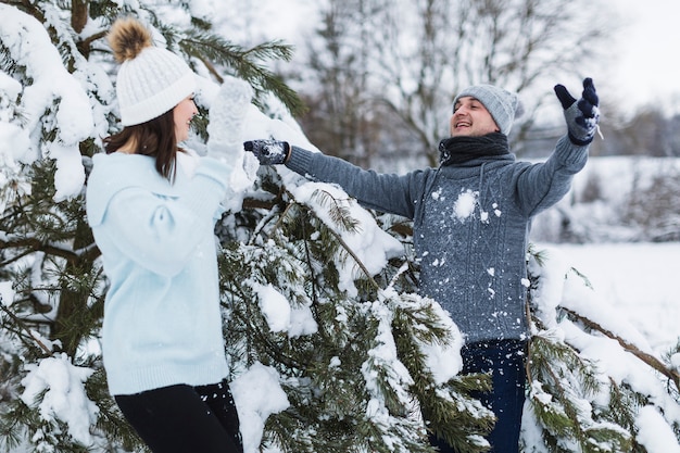 Couple playing snowballs