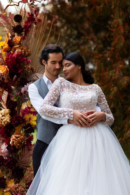 Couple posing at wedding front view