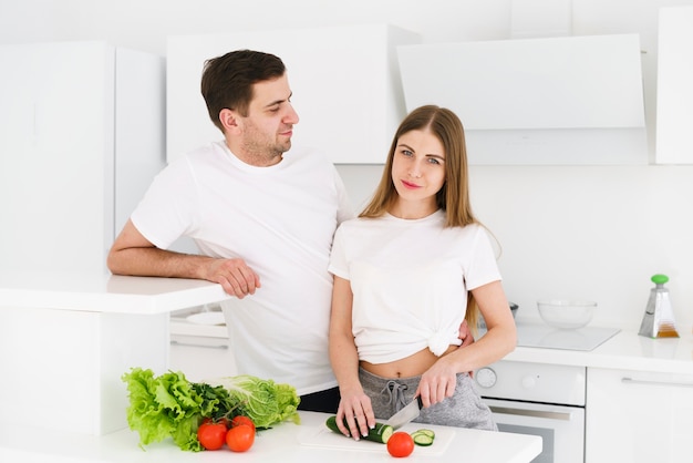 Couple preparing salad together