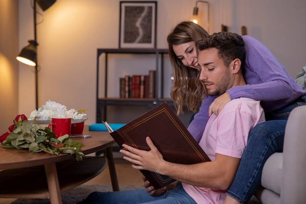 Couple relaxing at home in living room