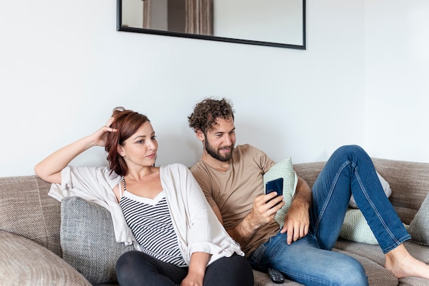 Couple relaxing together on the sofa