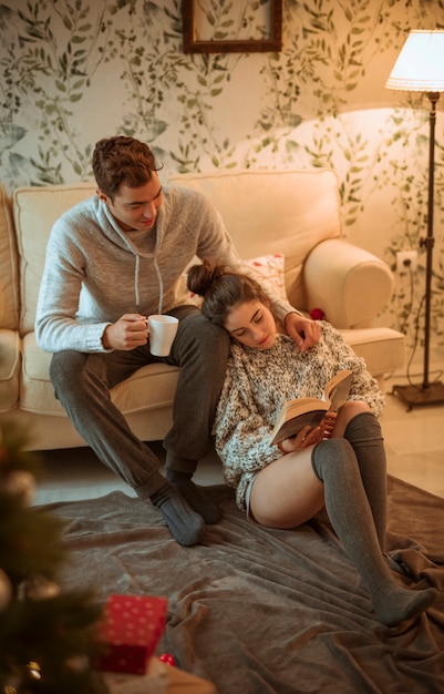 Free photo couple resting in living room