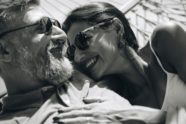 Couple resting together in a hammock