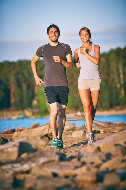 Free photo couple running in nature