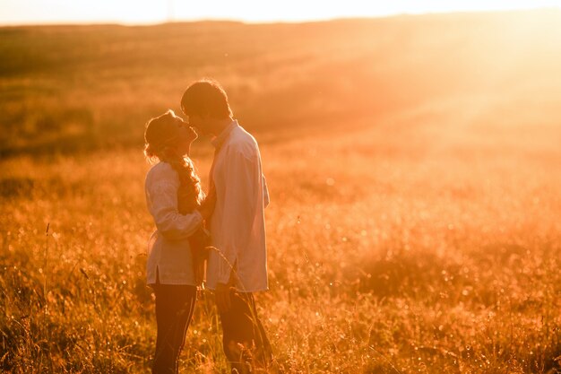 Couple running to the sunset