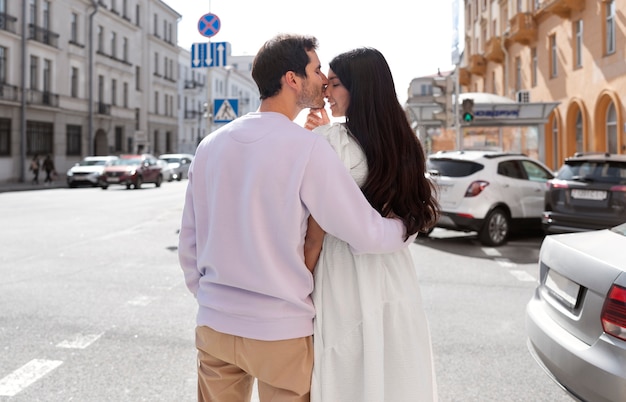 Free photo couple sharing tender public intimacy moments