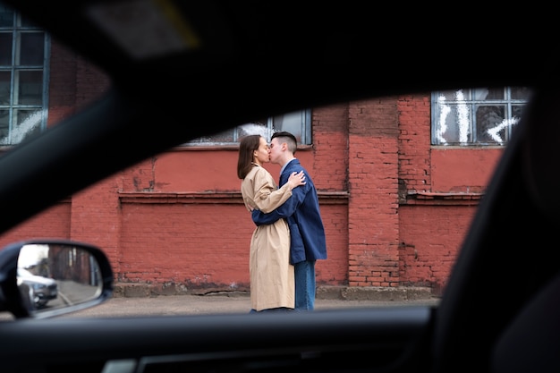 Free photo couple sharing tender public intimacy moments