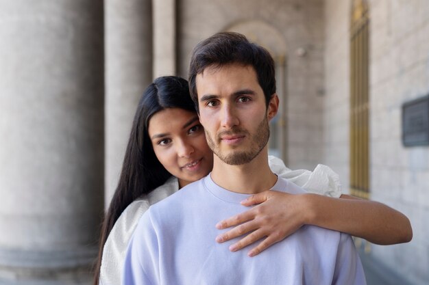 Couple sharing tender public intimacy moments