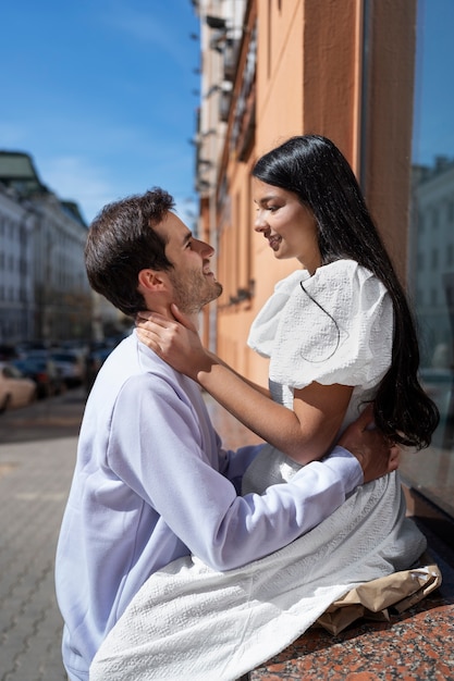 Free photo couple sharing tender public intimacy moments