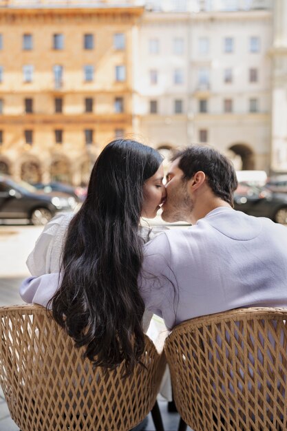 Couple sharing tender public intimacy moments