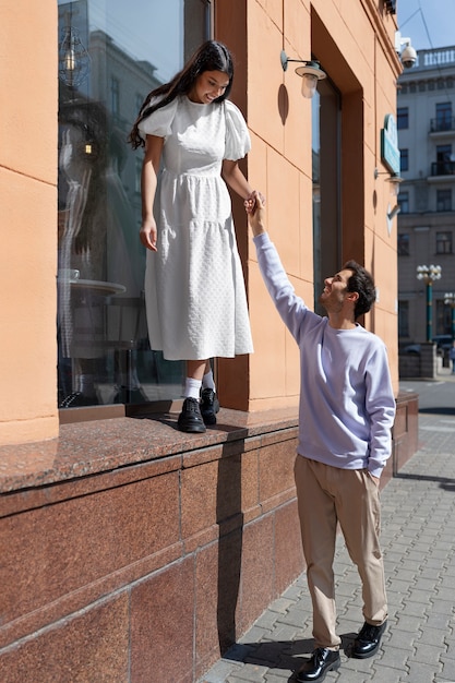 Couple sharing tender public intimacy moments