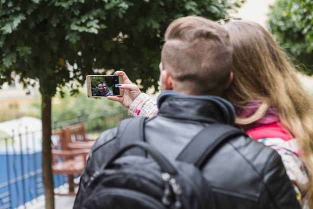 Free Photo couple shooting selfie in park