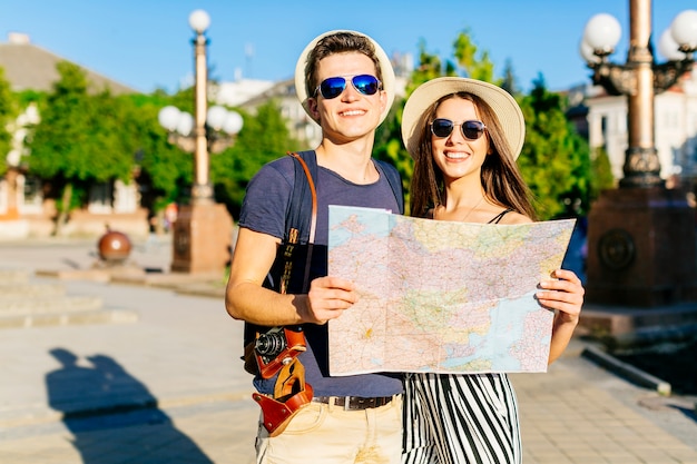 Couple sightseeing with map