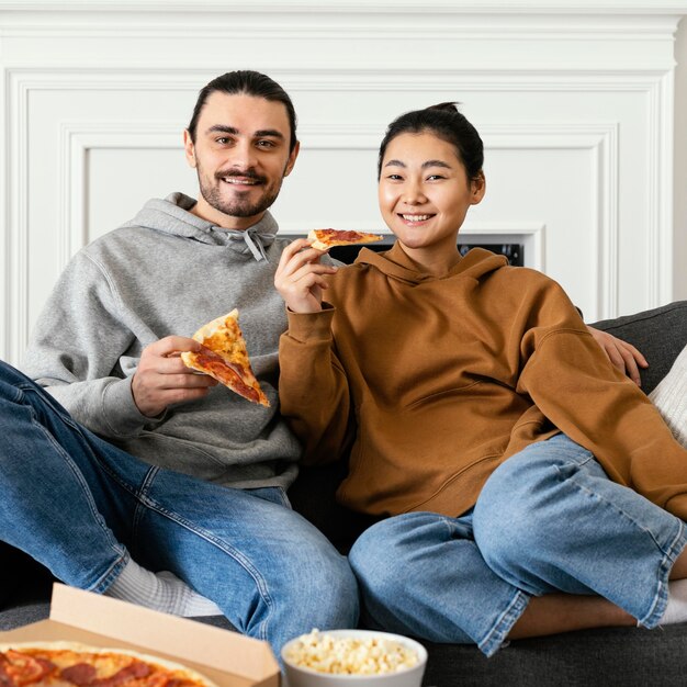 Couple sitting on the couch and spending fun time together