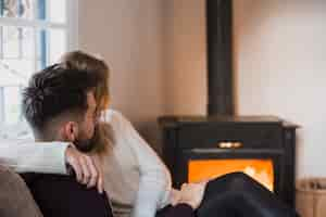 Free photo couple sitting in embrace