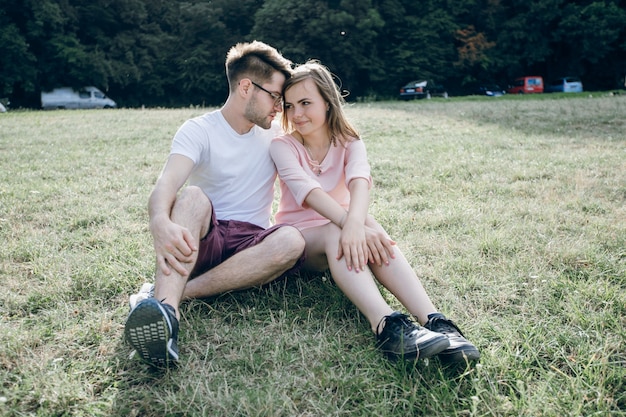 Couple sitting on the lawn lovingly