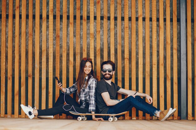 Couple sitting near wall