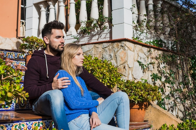 Couple sitting on stairs outdoor cute