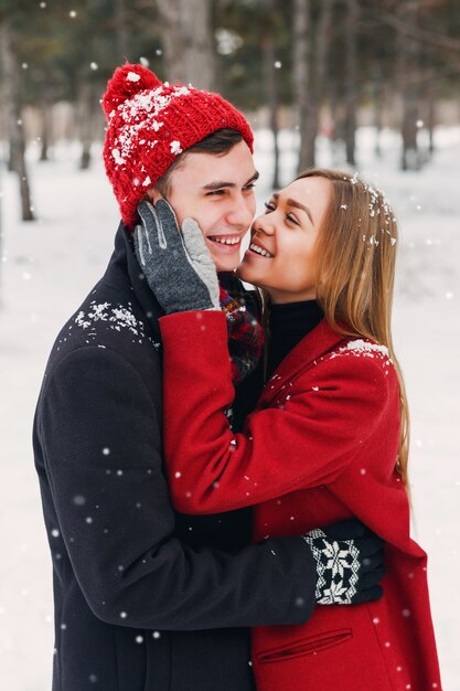 Couple smiling on a snowy day