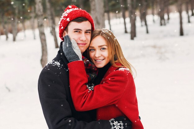 Couple smiling on a snowy day