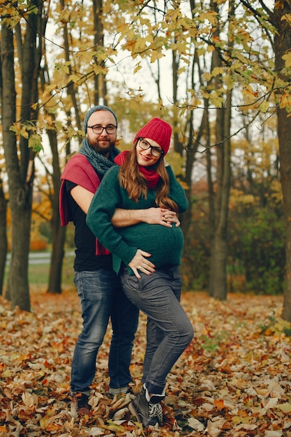 Couple spend time in a autumn park