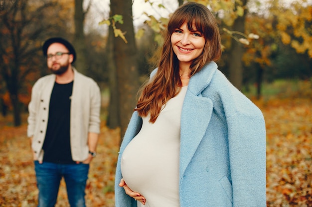 Couple spend time in a autumn park