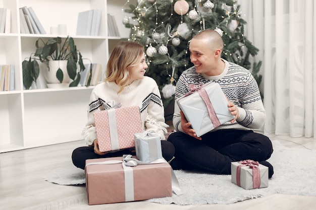 Couple spend time at home with christmas decorations