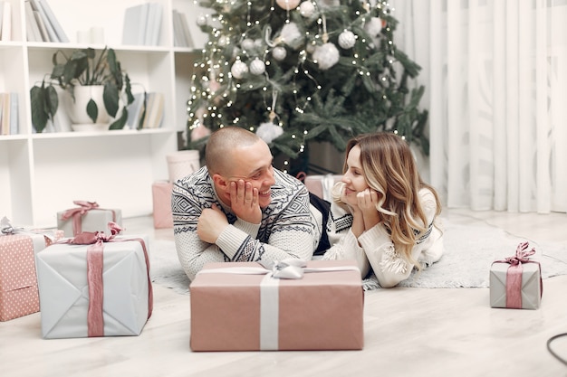 Couple spend time at home with christmas decorations