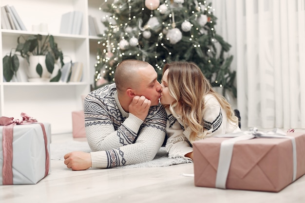 Couple spend time at home with christmas decorations