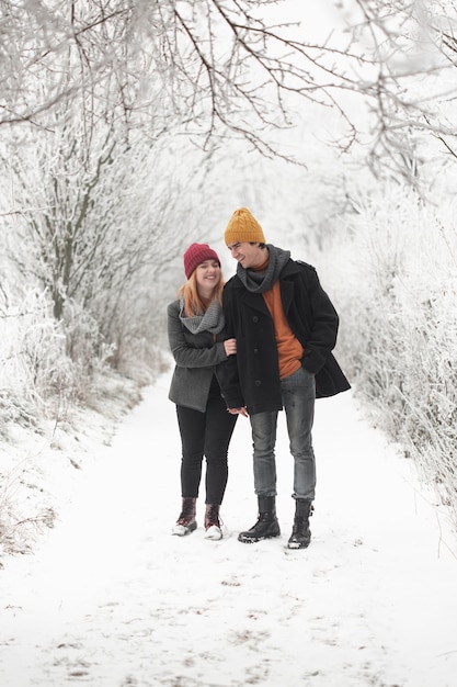 Couple spending time together and walks in snow