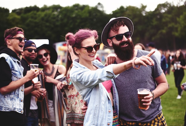 Free Photo couple standing in crowd at music festival