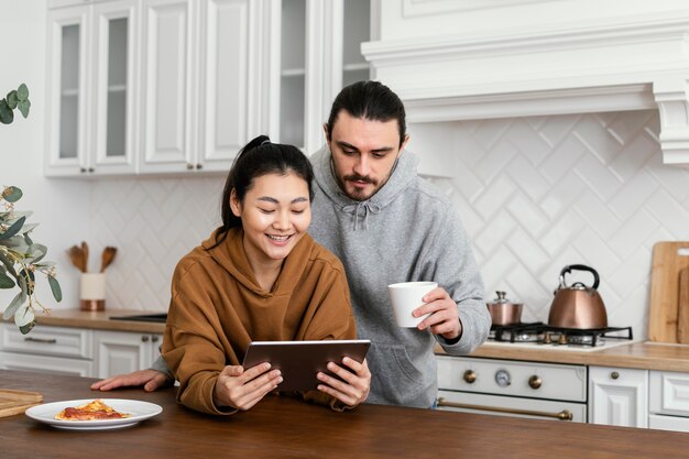 Couple taking breakfast in the kitchen