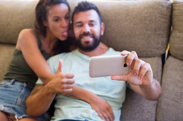 Couple taking selfie on smartphone