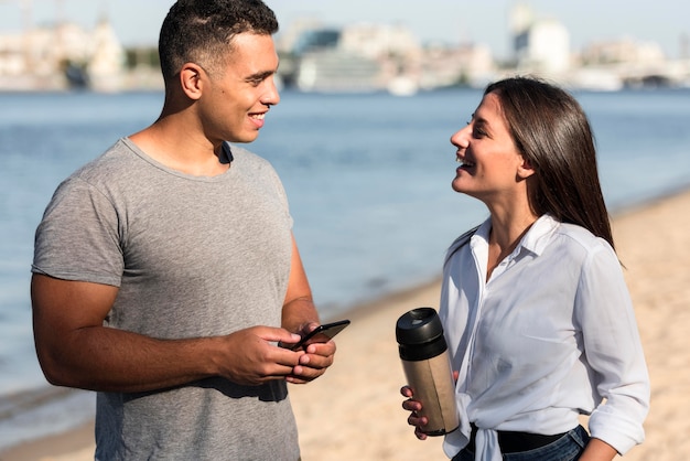 Couple talking on the beach